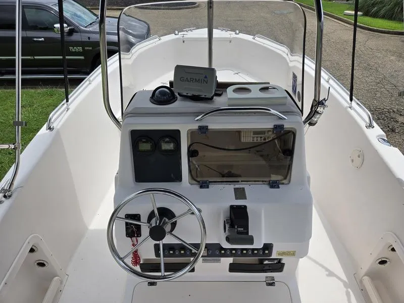 Slide: The Image of 2002 Grady-White 209 ESCAPE boat console with Garmin navigation system and steering wheel. - 16