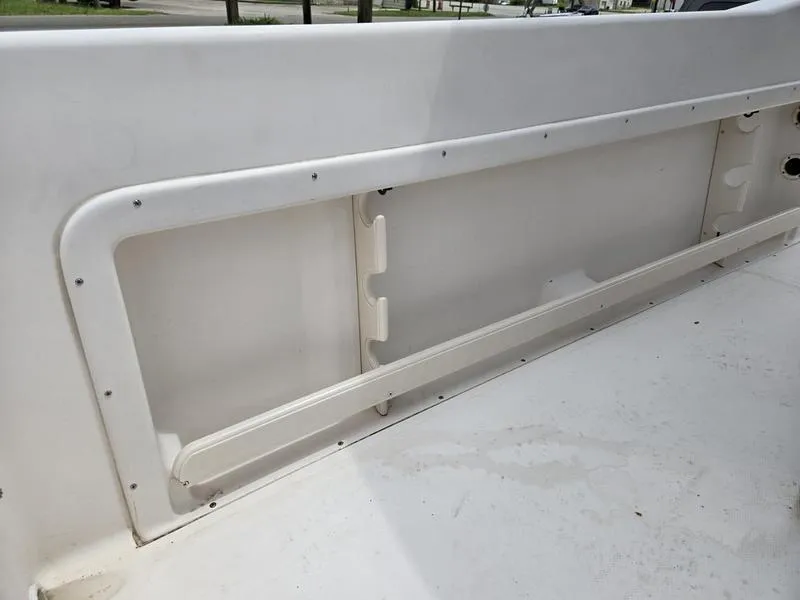 Slide: The Image of Interior view of a 2002 Grady-White 209 ESCAPE boat, showcasing storage compartment. - 17