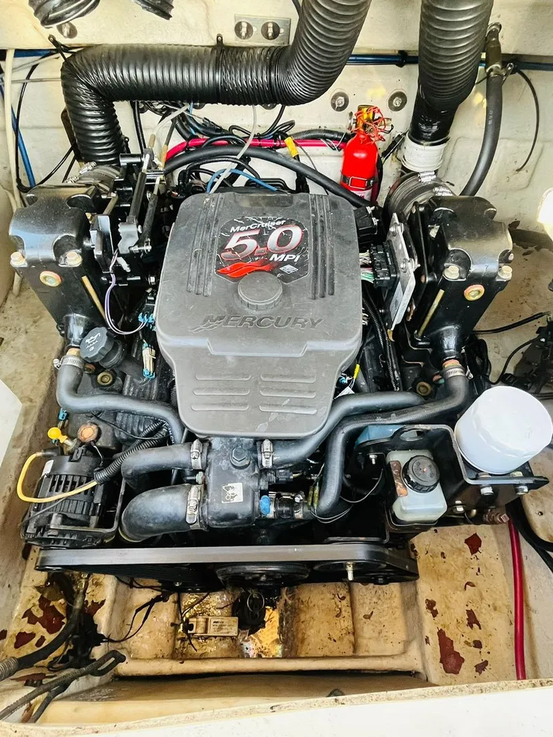 Slide: The Image of Engine of 2005 Sea Ray 240 Sundeck boat, featuring a Mercury 5.0 MPI. - 11