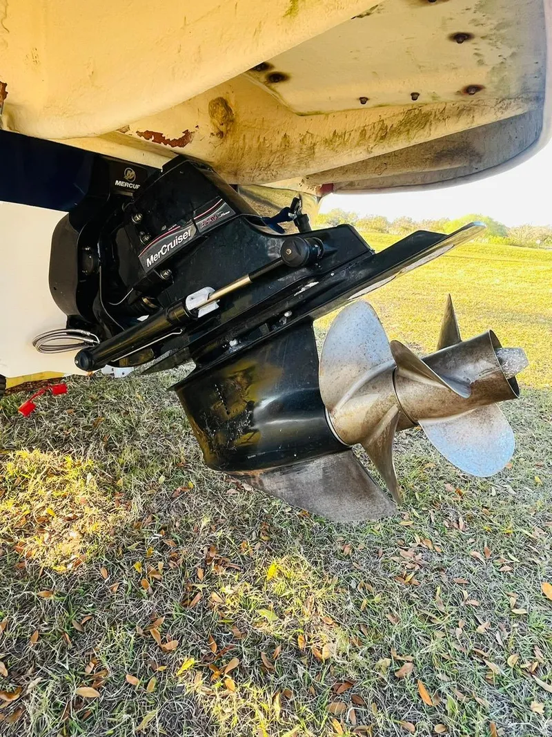 Slide: The Image of 2005 Sea Ray 240 Sundeck boat propeller and MerCruiser engine detail. - 12