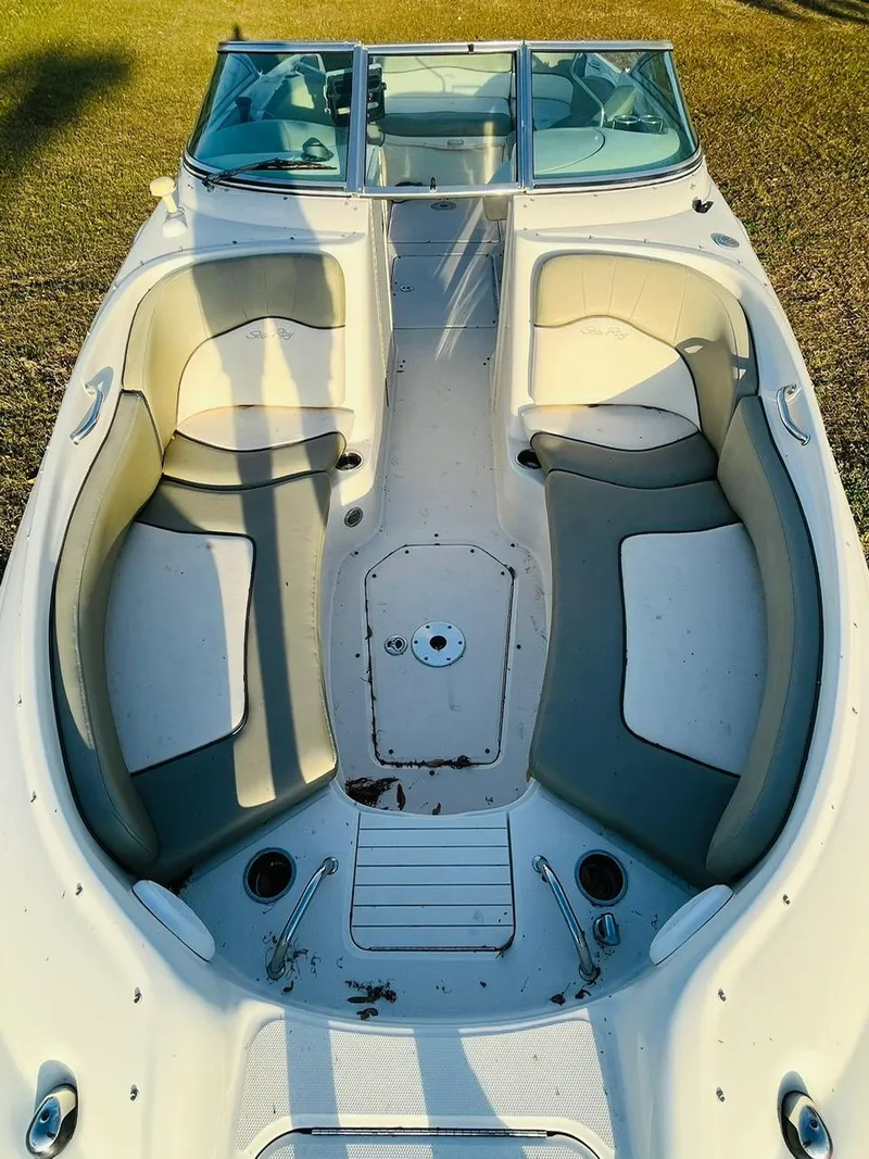 Slide: The Image of 2005 Sea Ray 240 Sundeck boat interior with spacious seating and clean design. - 6