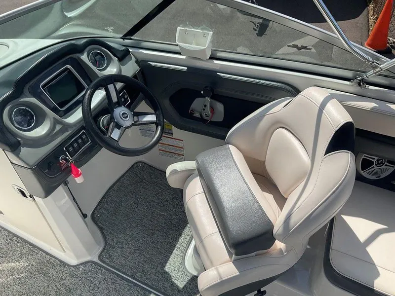 Slide: The Image of 2018 Chaparral 203 VR boat interior with steering wheel and captain's seat. - 12