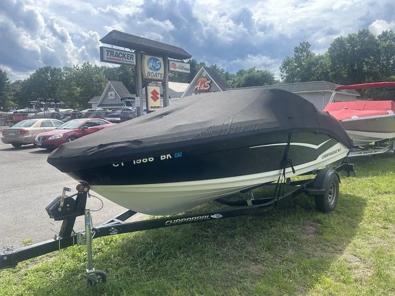 Slide: The Image of 2018 Chaparral 203 VR boat covered on trailer at dealership lot. - 13