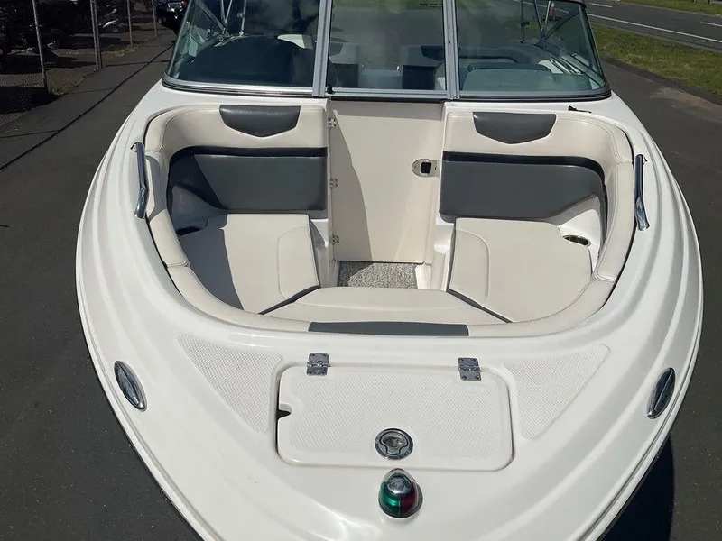 Slide: The Image of 2018 Chaparral 203 VR boat with spacious seating and sleek design. - 14