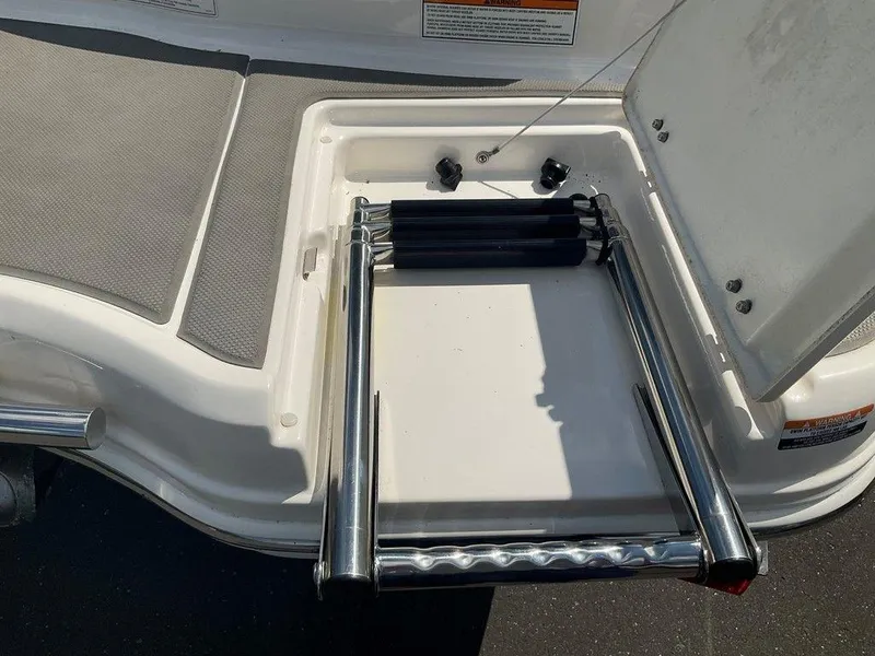 Slide: The Image of 2018 Chaparral 203 VR boat with foldable stainless steel ladder on deck. - 15