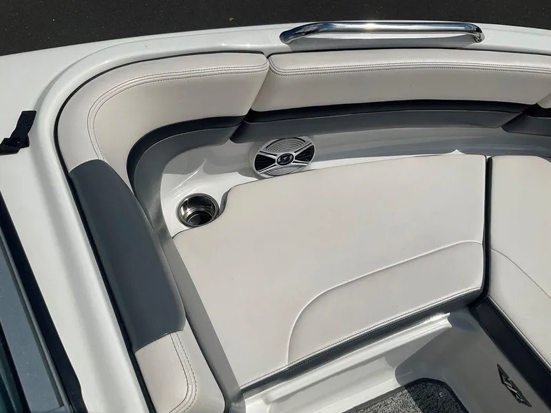 Slide: The Image of 2018 Chaparral 203 VR boat interior with cushioned seating and speaker. - 16