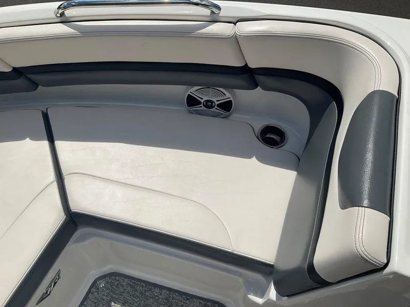 Slide: The Image of 2018 Chaparral 203 VR boat interior with cushioned seating and speaker. - 18