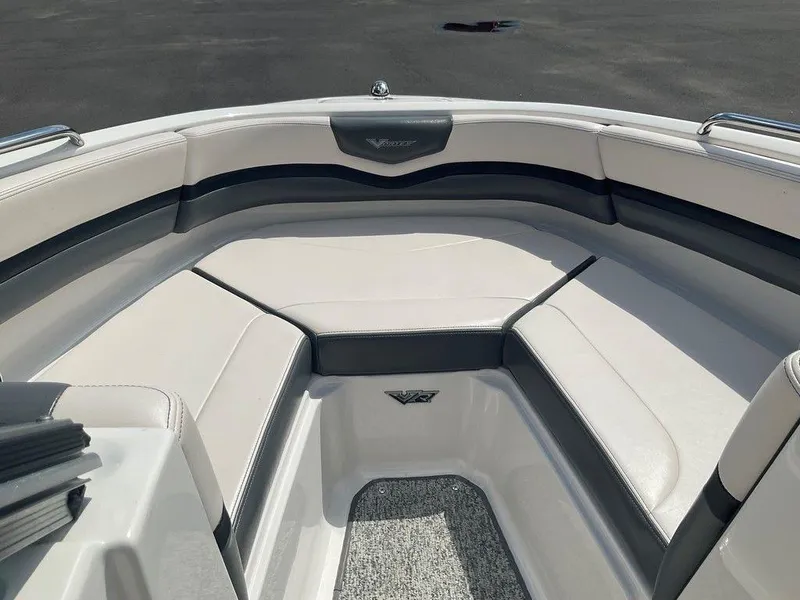 Slide: The Image of 2018 Chaparral 203 VR boat interior with cushioned seating and sleek design. - 19