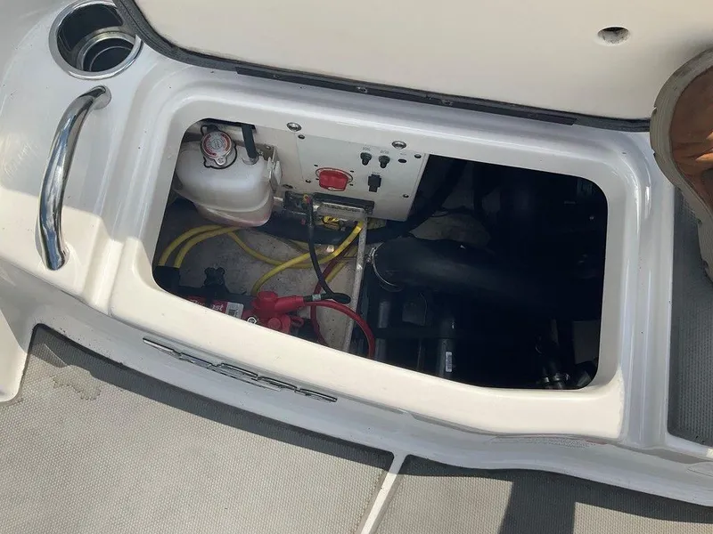 Slide: The Image of Engine compartment of a 2018 Chaparral 203 VR boat, showing wiring and components. - 22