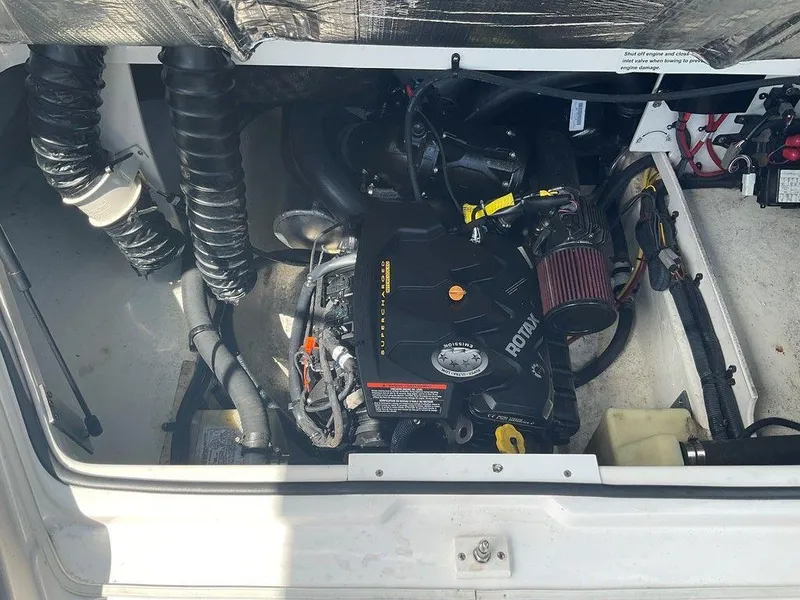 Slide: The Image of Engine compartment of a 2018 Chaparral 203 VR boat, featuring a Rotax engine. - 25