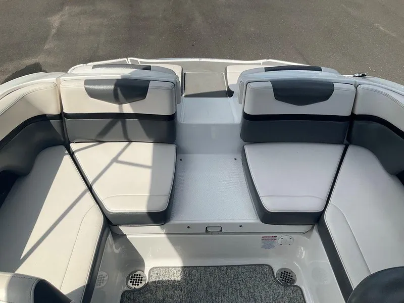 Slide: The Image of 2018 Chaparral 203 VR boat interior with gray and white seating arrangement. - 7