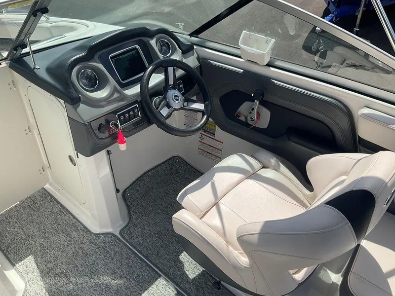 Slide: The Image of 2018 Chaparral 203 VR boat interior with steering wheel and dashboard controls. - 9