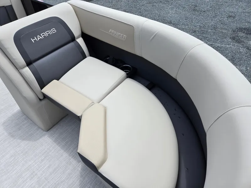 Slide: The Image of Luxurious seating on 2026 Harris Cruiser 230 boat, featuring elegant upholstery and cup holders. - 12