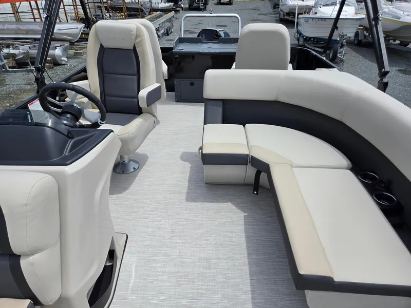 Slide: The Image of 2026 Harris Cruiser 230 boat interior with plush seating and modern steering console. - 13