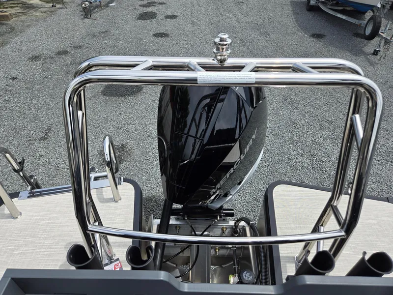 Slide: The Image of 2026 Harris Cruiser 230 boat with Mercury engine, viewed from the rear deck. - 26