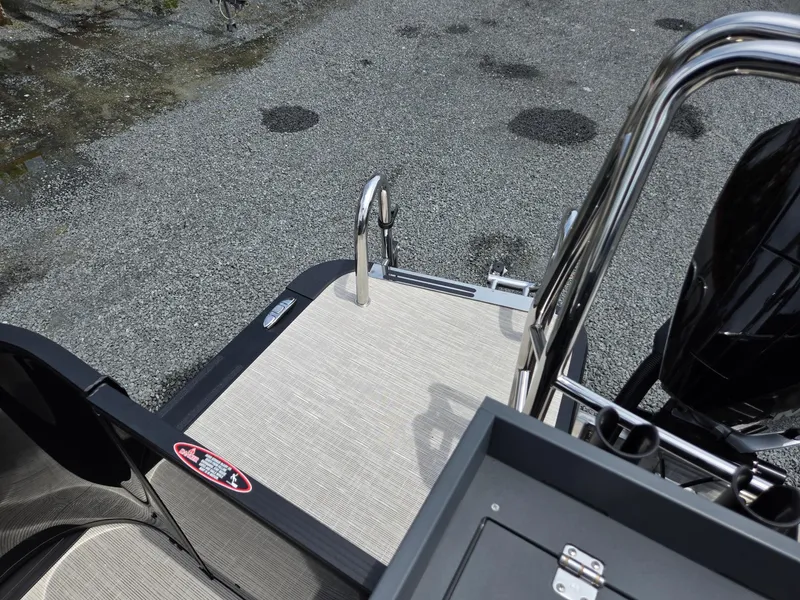 Slide: The Image of 2026 Harris Cruiser 230 boat deck with stainless steel railing and textured flooring. - 27