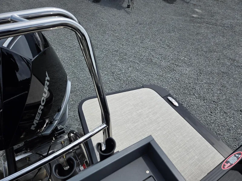 Slide: The Image of 2026 Harris Cruiser 230 boat with Mercury engine, featuring sleek design and modern deck. - 28