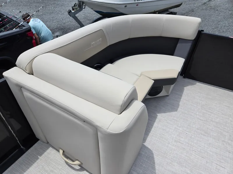 Slide: The Image of 2026 Harris Cruiser 230 boat interior with beige seating and modern design. - 35