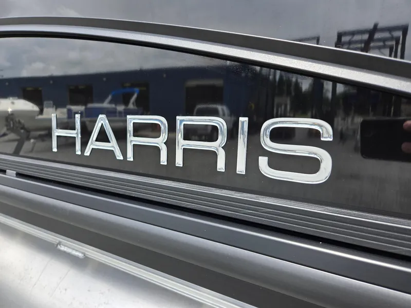 Slide: The Image of Close-up of 2026 Harris Cruiser 230 logo on boat exterior. - 36
