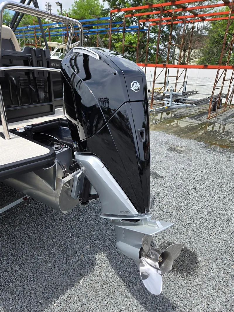 Slide: The Image of 2026 Harris Cruiser 230 boat with a sleek black outboard motor. - 39