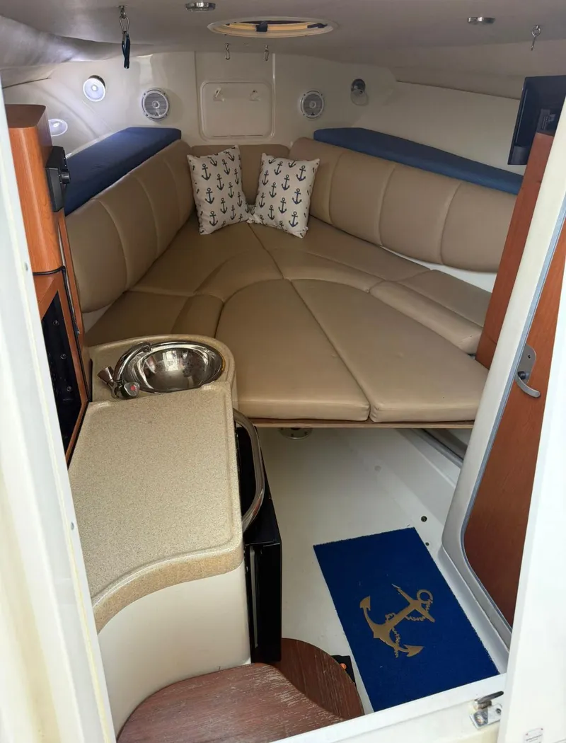 Slide: The Image of 2008 Hydra-Sports Vector 2800 WA cabin interior with beige seating and nautical decor. - 11