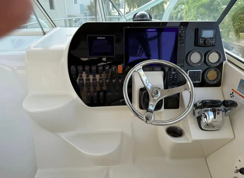 Slide: The Image of 2008 Hydra-Sports Vector 2800 WA boat dashboard with steering wheel and control panel. - 7