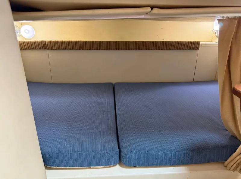 Slide: The Image of 2008 Hydra-Sports Vector 2800 WA cabin interior with blue cushions and ambient lighting. - 9