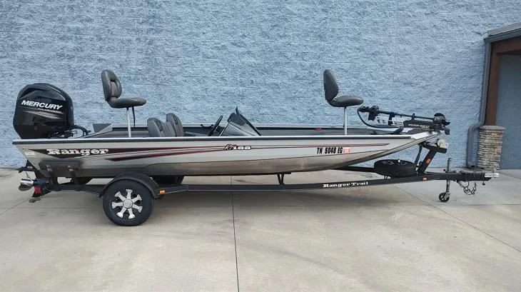 Slide: The Image of 2014 Ranger RT188 boat with Mercury engine on trailer, parked on concrete. - 1