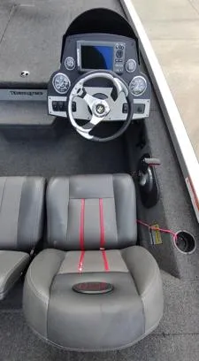 Slide: The Image of 2014 Ranger RT188 boat interior with steering wheel and seating. - 10