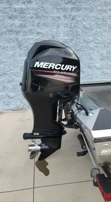 Slide: The Image of 2014 Ranger RT188 boat with Mercury outboard motor against a gray wall. - 13