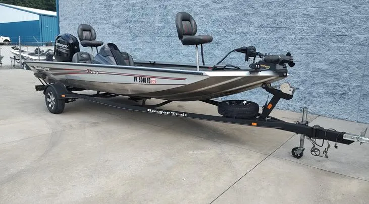 Slide: The Image of 2014 Ranger RT188 fishing boat on trailer, parked outdoors. - 2