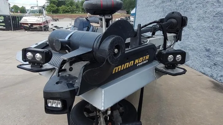 Slide: The Image of 2014 Ranger RT188 boat with Minn Kota motor, parked outdoors. - 4