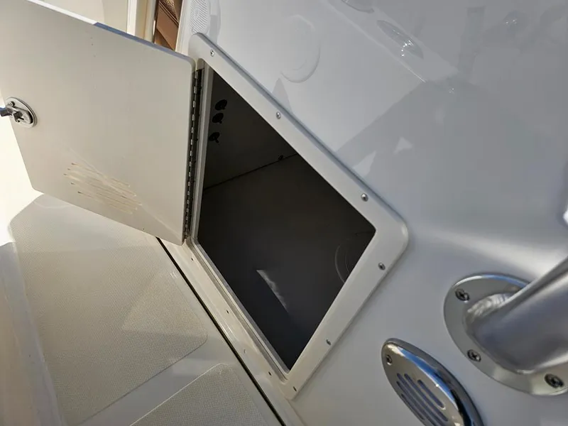 Slide: The Image of Open storage compartment on 2025 Pioneer 180 Islander boat, showcasing interior space. - 17