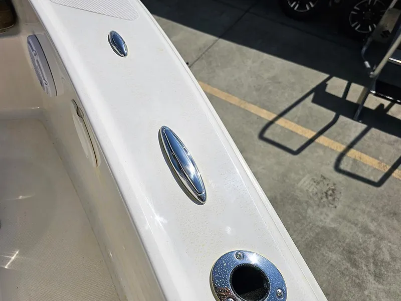 Slide: The Image of 2025 Pioneer 180 Islander boat deck with chrome fittings and speaker. - 22