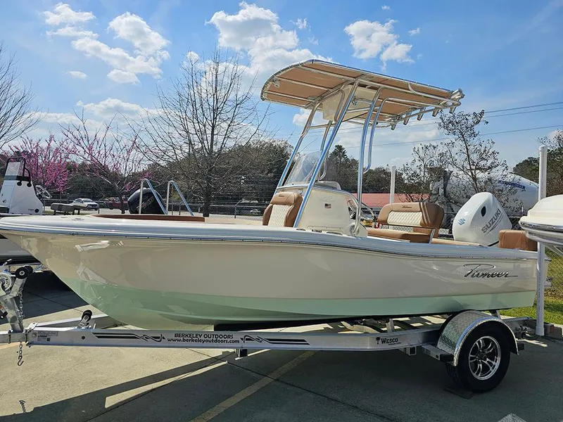 Slide: The Image of 2025 Pioneer 180 Islander boat on trailer, sunny day, outdoor display. - 6