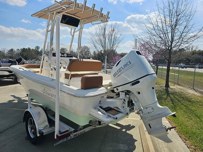 Slide: The Image of 2025 Pioneer 180 Islander boat with Suzuki outboard motor on a trailer. - 7