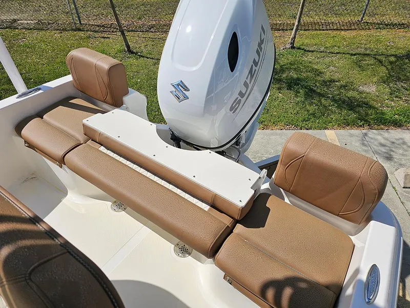 Slide: The Image of 2025 Pioneer 180 Islander boat with Suzuki engine, featuring brown cushioned seating. - 9