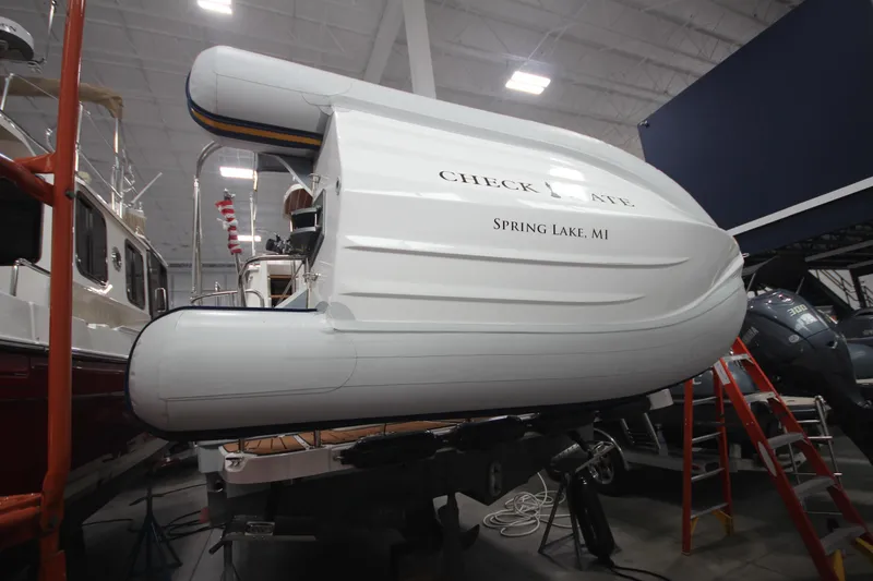 Slide: The Image of 2024 Ranger Tugs R-29 Command Bridge LE in showroom, Spring Lake, MI. - 15