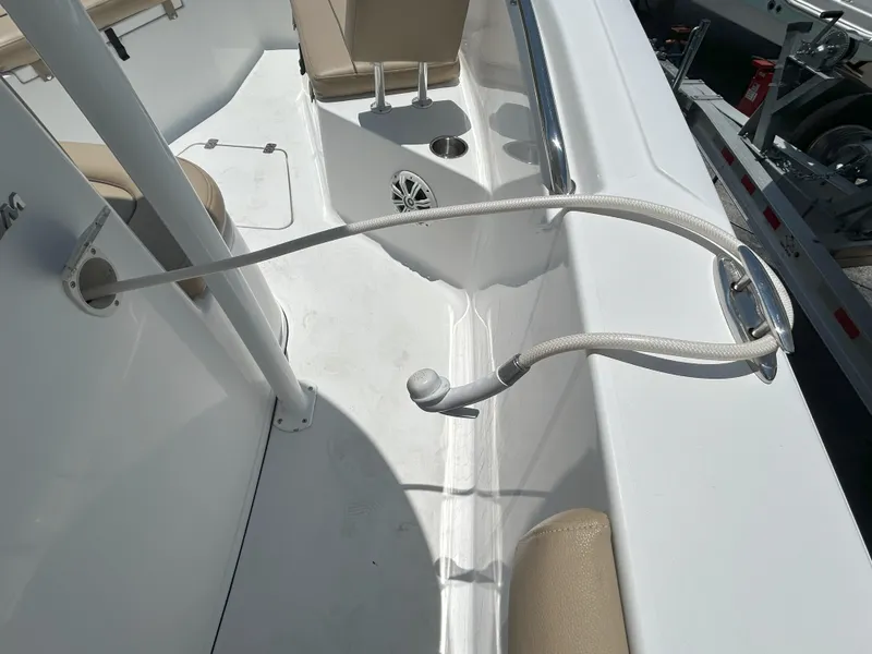 Slide: The Image of 2016 Sportsman Open 232 Center Console boat interior with hose attachment. - 12