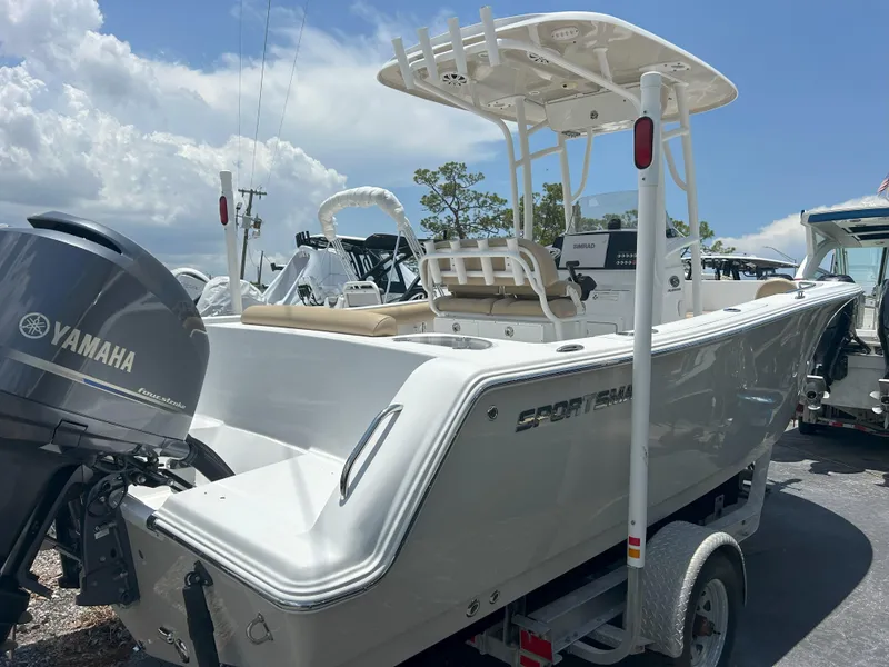 Slide: The Image of 2016 Sportsman Open 232 Center Console boat with Yamaha engine, parked on a trailer. - 4