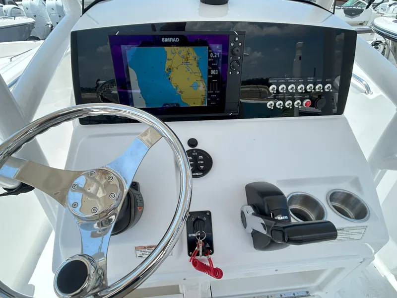 Slide: The Image of 2016 Sportsman Open 232 Center Console dashboard with navigation display and controls. - 9