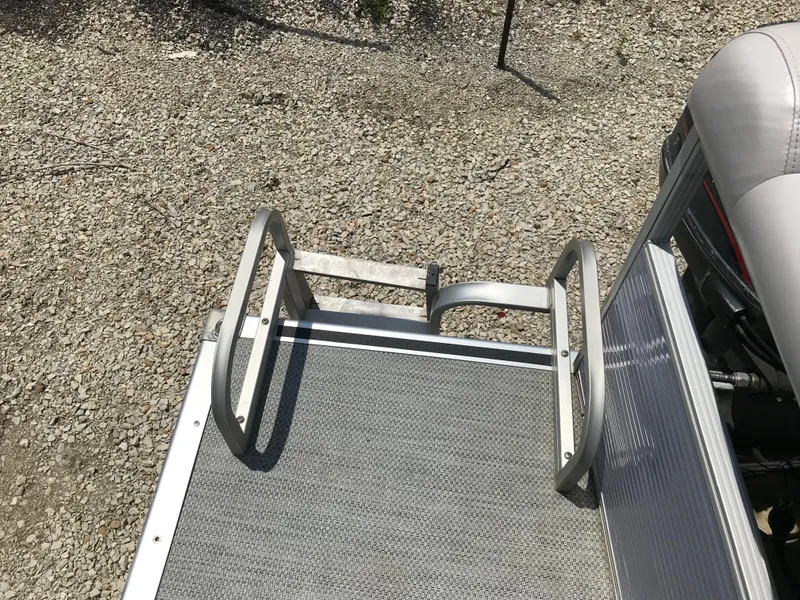 Slide: The Image of Bennington 2050LX 1998 boat ladder on gravel background. - 11