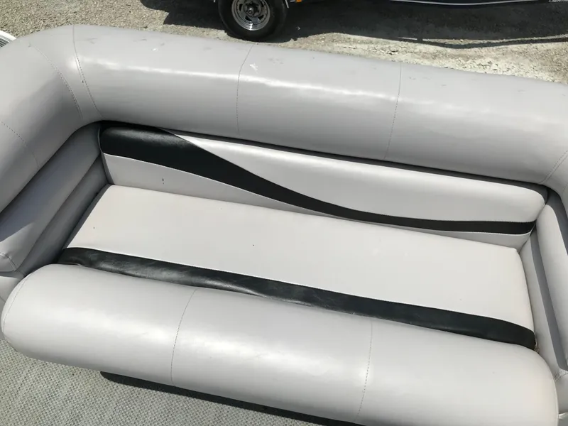 Slide: The Image of Gray and black boat seating on a 1998 Bennington 2050LX. - 14