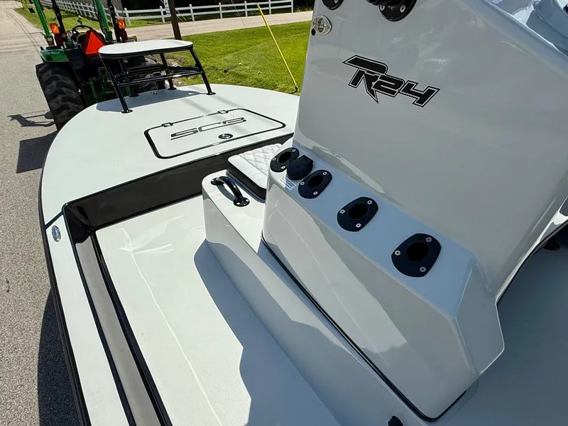 Slide: The Image of 2025 SCB R24 boat on trailer, showcasing sleek design and modern features. - 12