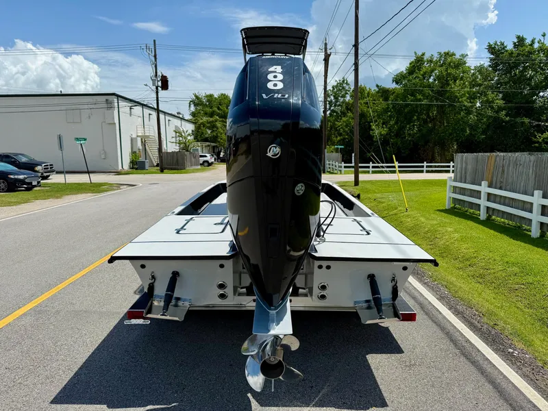 Slide: The Image of 2025 SCB R24 boat with powerful 400 V10 engine on a sunny street. - 3