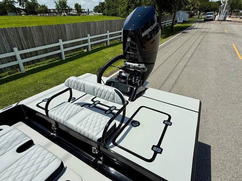Slide: The Image of 2025 SCB R24 boat with Mercury engine, featuring sleek seating and modern design. - 7