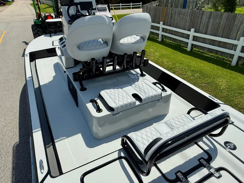 Slide: The Image of 2025 SCB R24 boat with white seating and sleek design on a sunny day. - 8