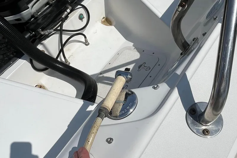 Slide: The Image of Boston Whaler 210 Ventura 2005 boat deck with hose and fittings. - 15