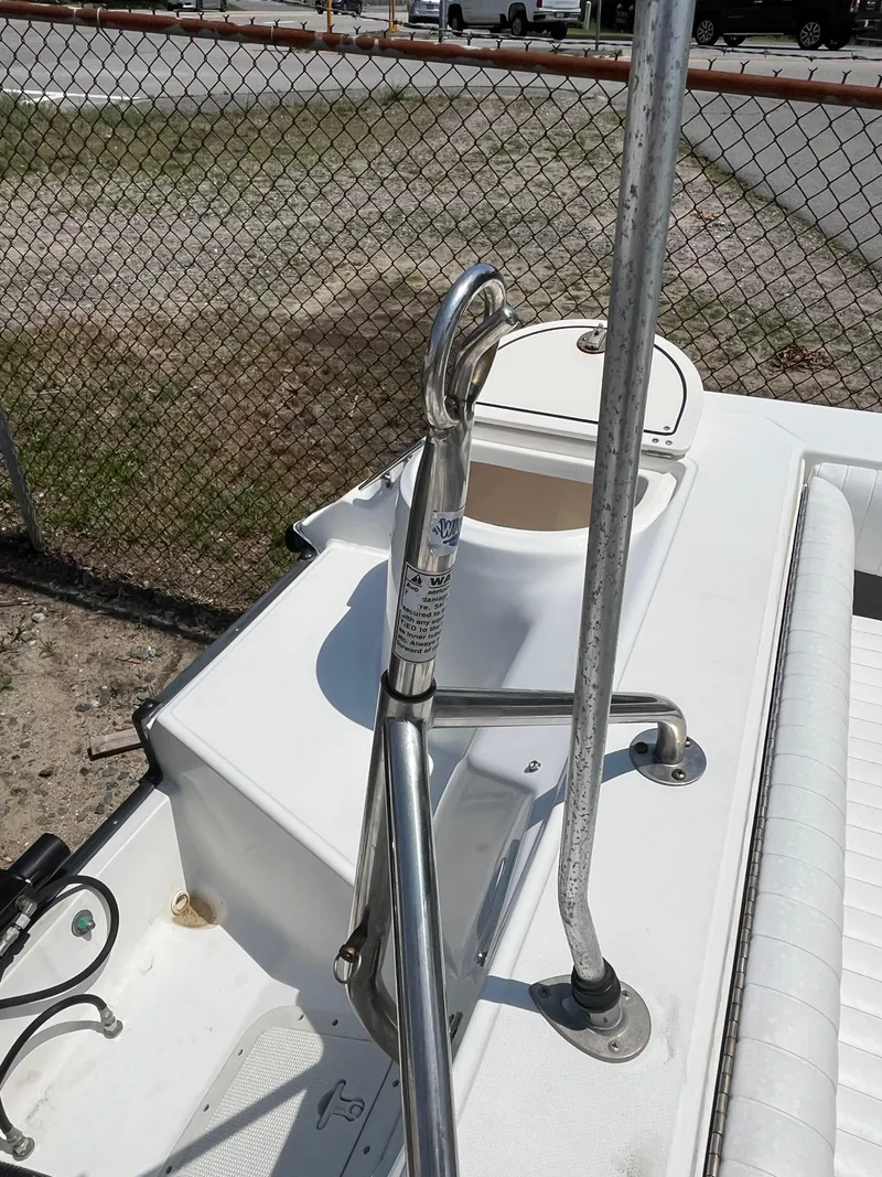 Slide: The Image of 2005 Boston Whaler 210 Ventura boat deck with stainless steel railing and seating. - 16