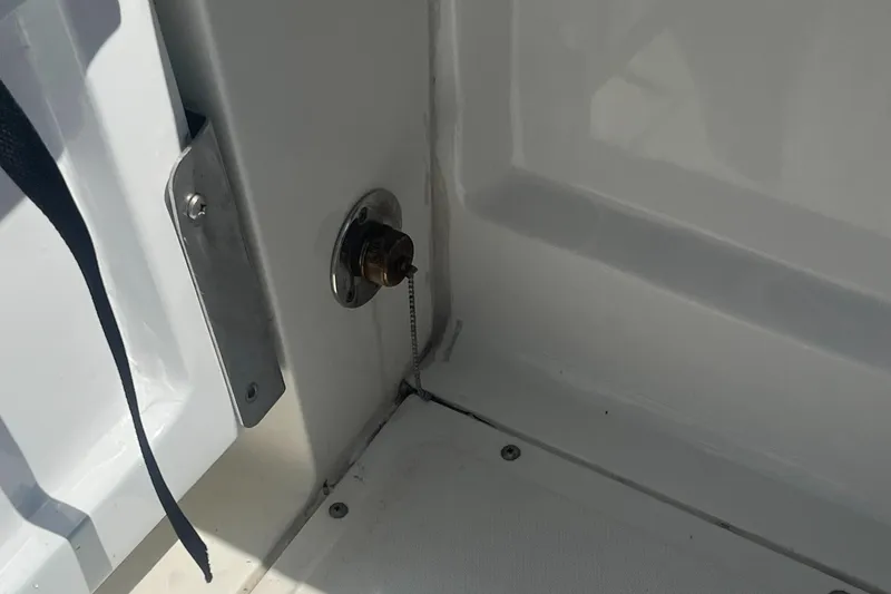 Slide: The Image of 2005 Boston Whaler 210 Ventura boat interior detail with metal fixture and chain. - 17